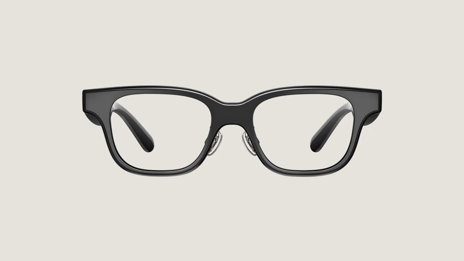 AirCaps smart glasses in black, shown from the front on a plain light background, with a thick square frame and clear lenses.