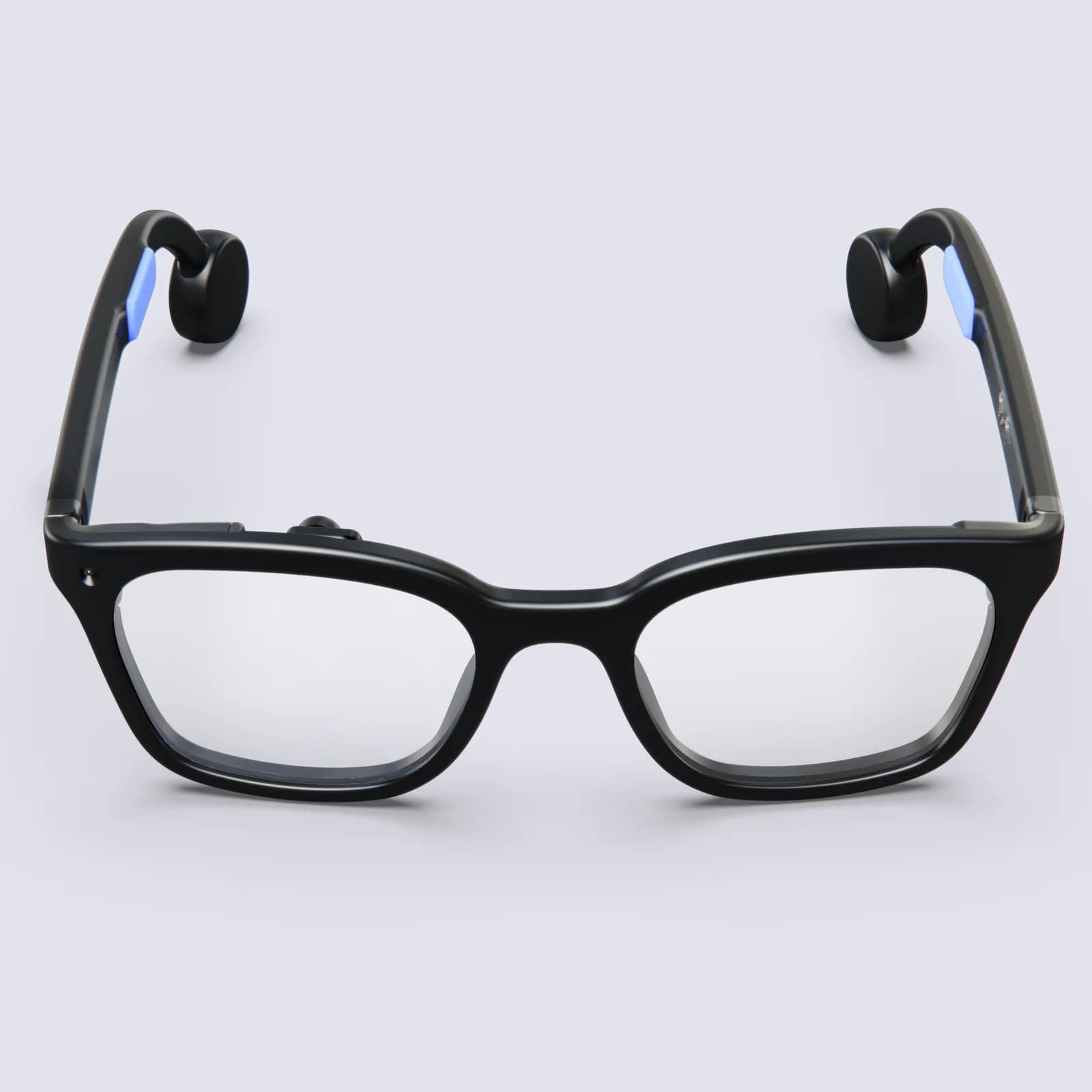 Gafas Brilliant Labs Halo en negro, de frente, con montura cuadrada gruesa, lentes transparentes y un punto sobre la lente izquierda.