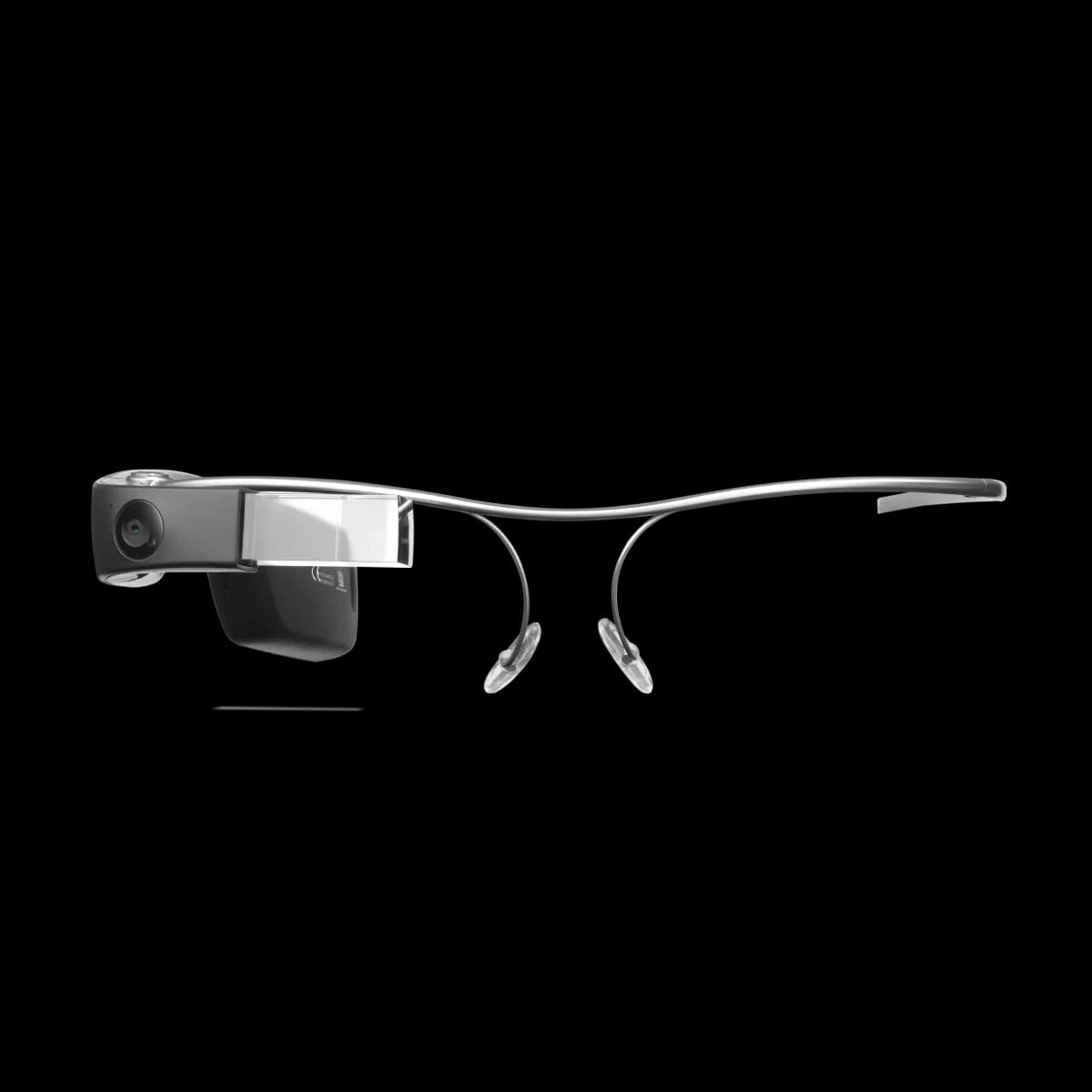Envision Glasses en negro, vista lateral de la montura de titanio con una cámara pequeña y un prisma transparente frente al ojo.