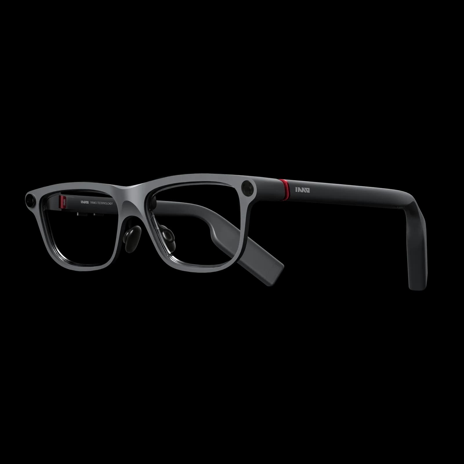 Gafas INMO GO3 en gris y negro, cámara pequeña en la esquina superior, anillo rojo en la bisagra, INMO en la patilla, cristales sin aro.