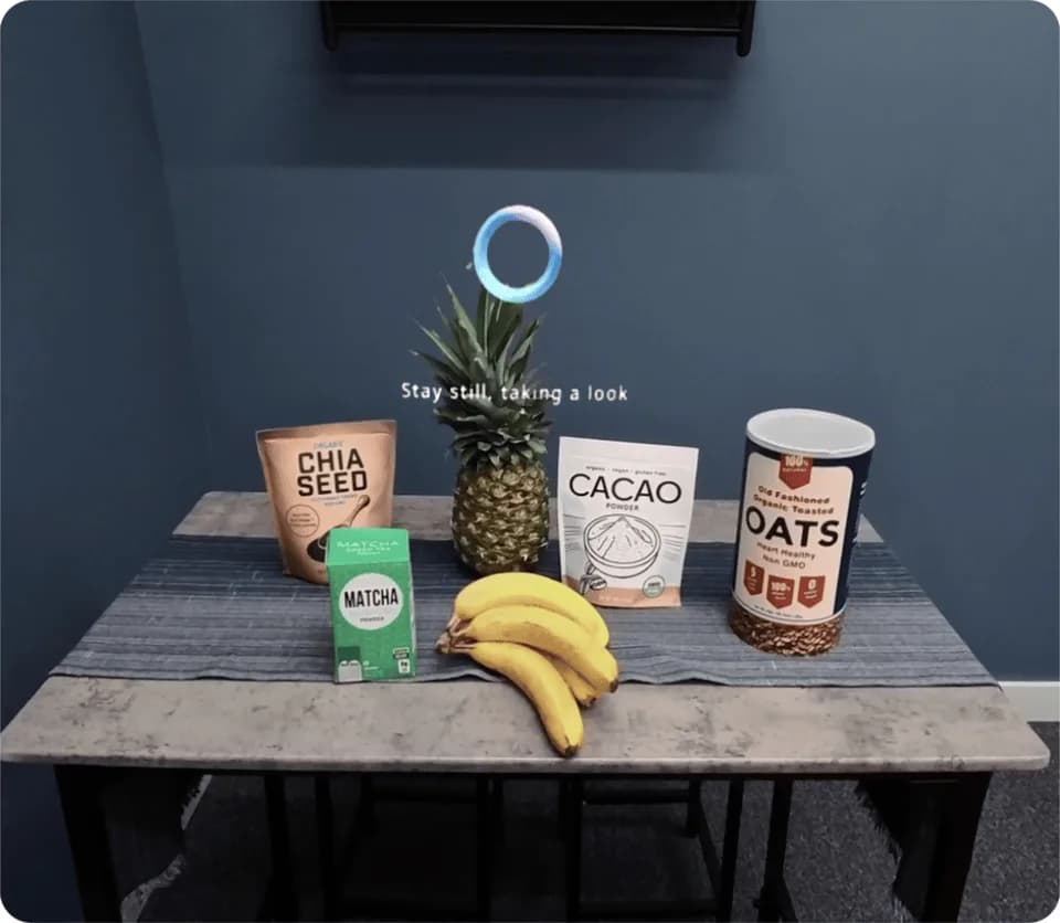 Meta Orion display view of pantry items on a table, with a glowing ring icon and English text overlaid above them.