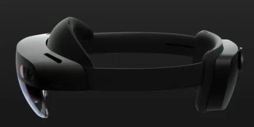 Microsoft HoloLens 2 headset in profile, a dark visor with camera sensors on the edge and a padded headband over the top.