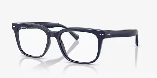 Gafas Nuance Audio Hearing Glasses en azul marino, montura cuadrada con cristales claros, en ángulo sobre fondo gris claro.