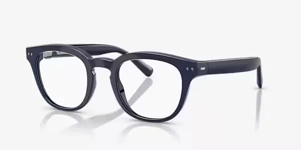 Nuance Audio Hearing Glasses in navy blue, a rounder Panthos-shaped frame with clear lenses, shown at an angle.