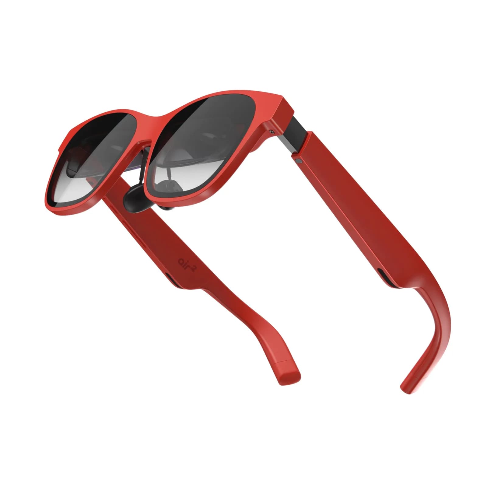 Gafas XREAL Air 2 en rojo, vistas por detrás sobre fondo blanco, con ambas patillas abiertas hacia los lados.