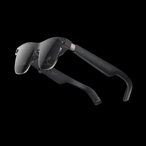 XREAL Air 2 Ultra glasses in black, three-quarter angle on a white background, with a copper-toned hinge on the temple arm.