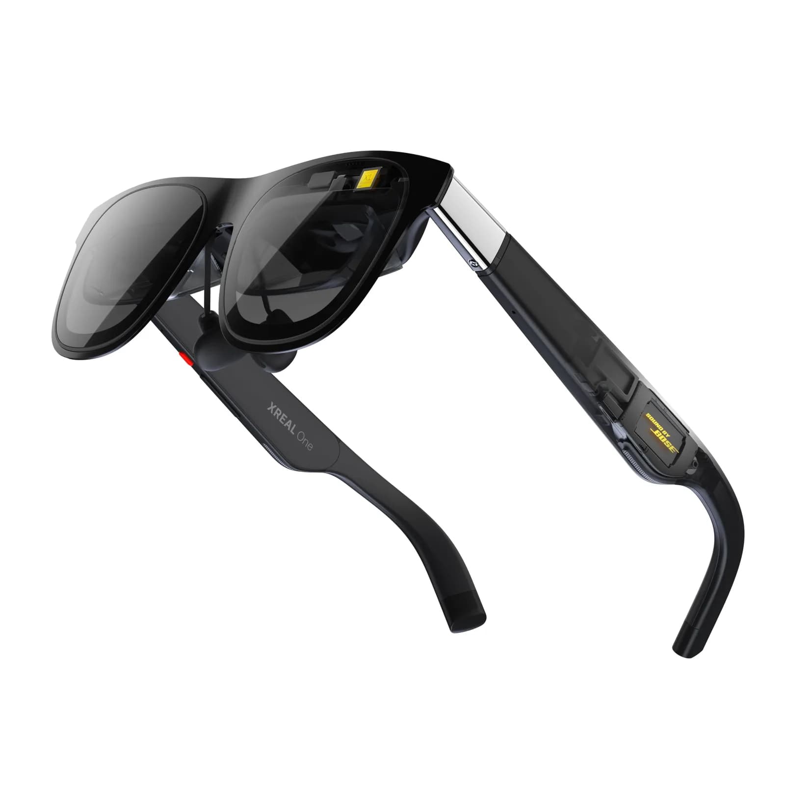 XREAL One glasses in black, folded at an angle on a white background, with the XREAL One name and a red indicator on the temple.
