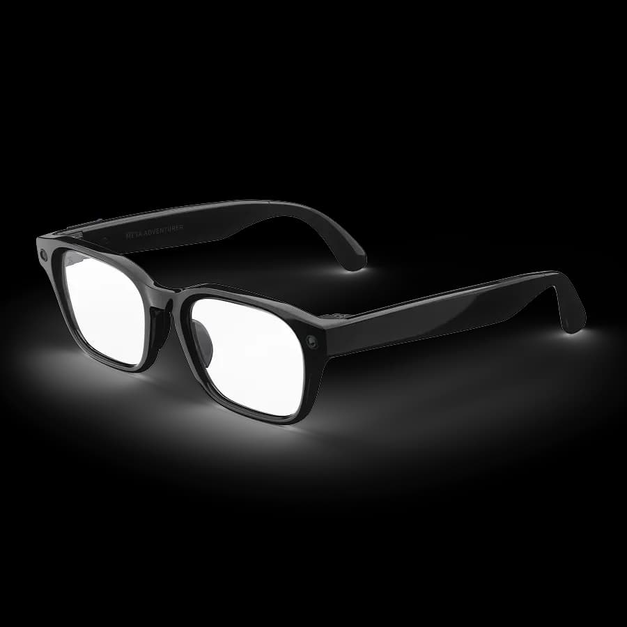 Meta Glasses Adventurer at an angle, black square frame with 'Meta Adventurer' printed on the temple and a camera lens on the hinge.