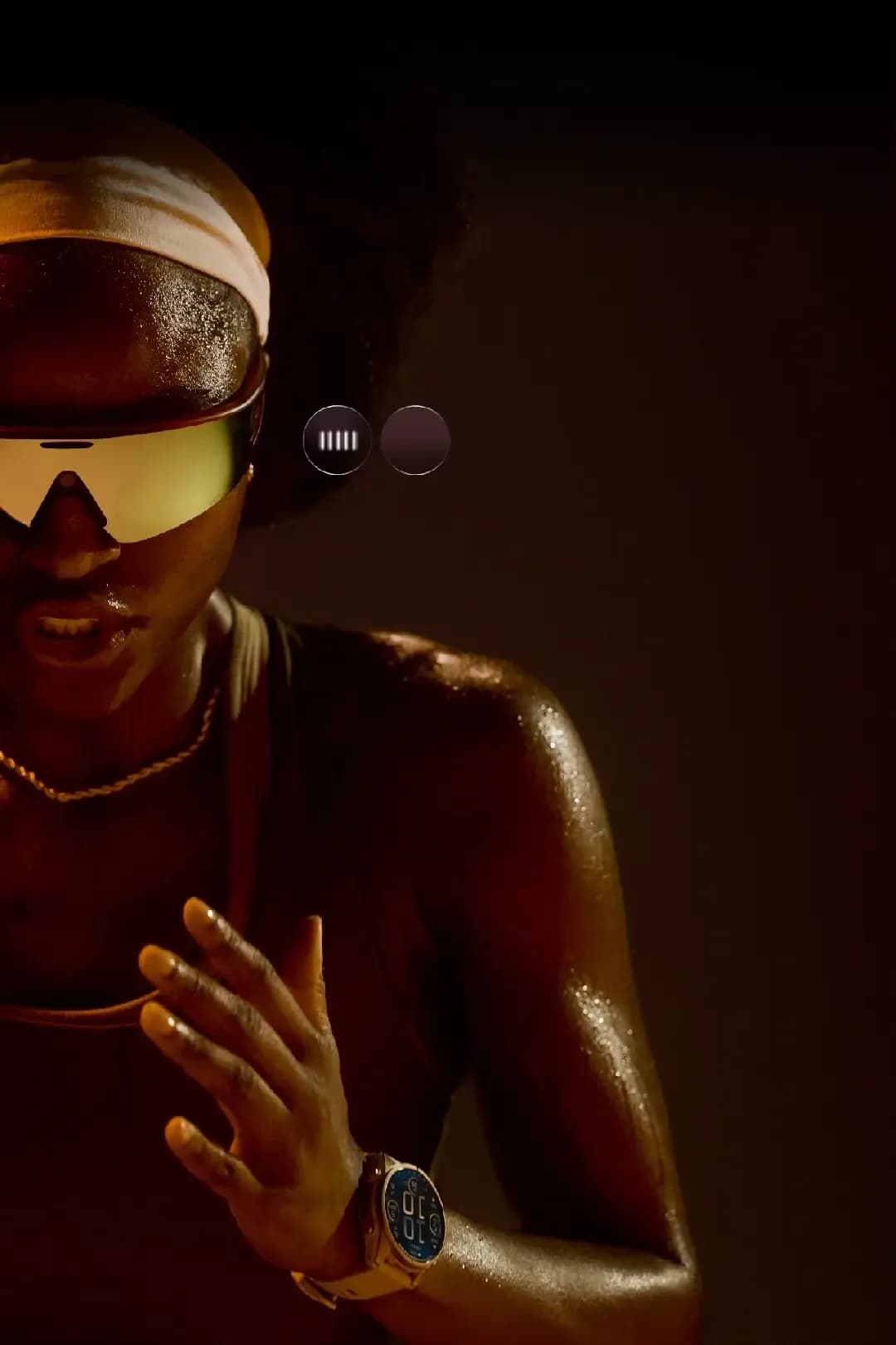 Oakley Meta Vanguard sport sunglasses with a curved amber mirrored lens, worn at night by a sweating runner wearing a light headband.