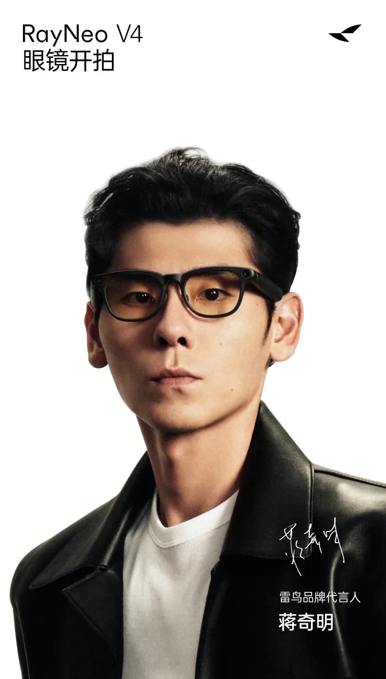 RayNeo V4 glasses in black with thick rectangular frames and amber tinted lenses, worn on a man's face, with a camera on the right temple.
