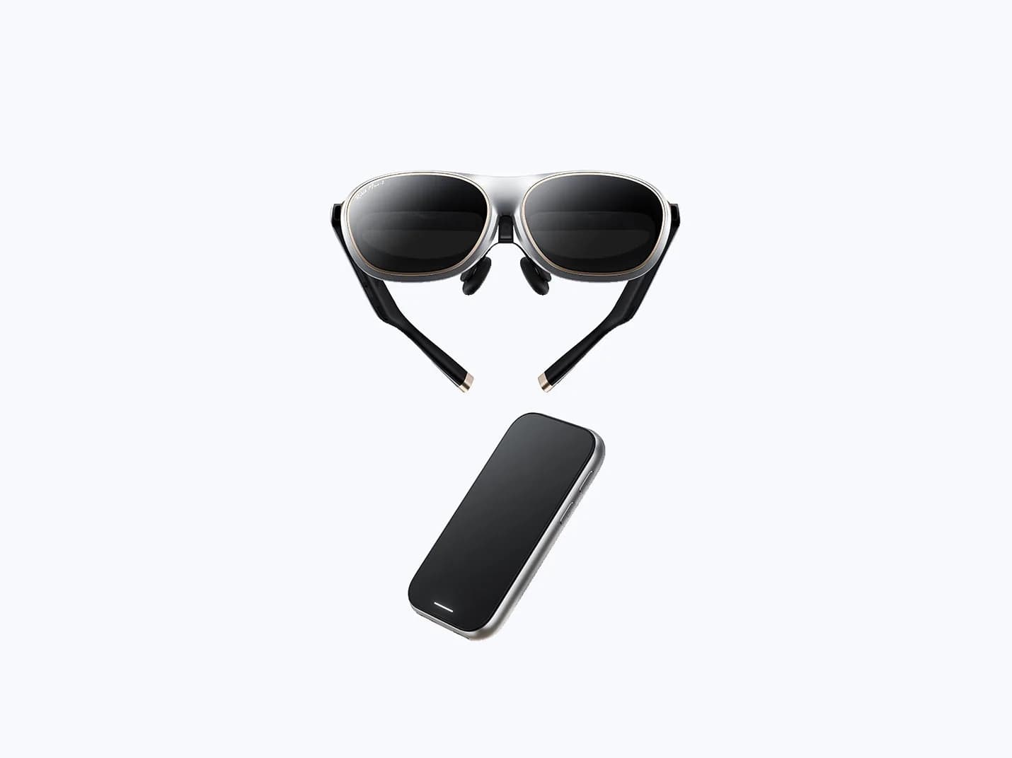 Rokid AR Spatial in silver with tan trim and round dark lenses, shown above a separate slim black handheld controller.