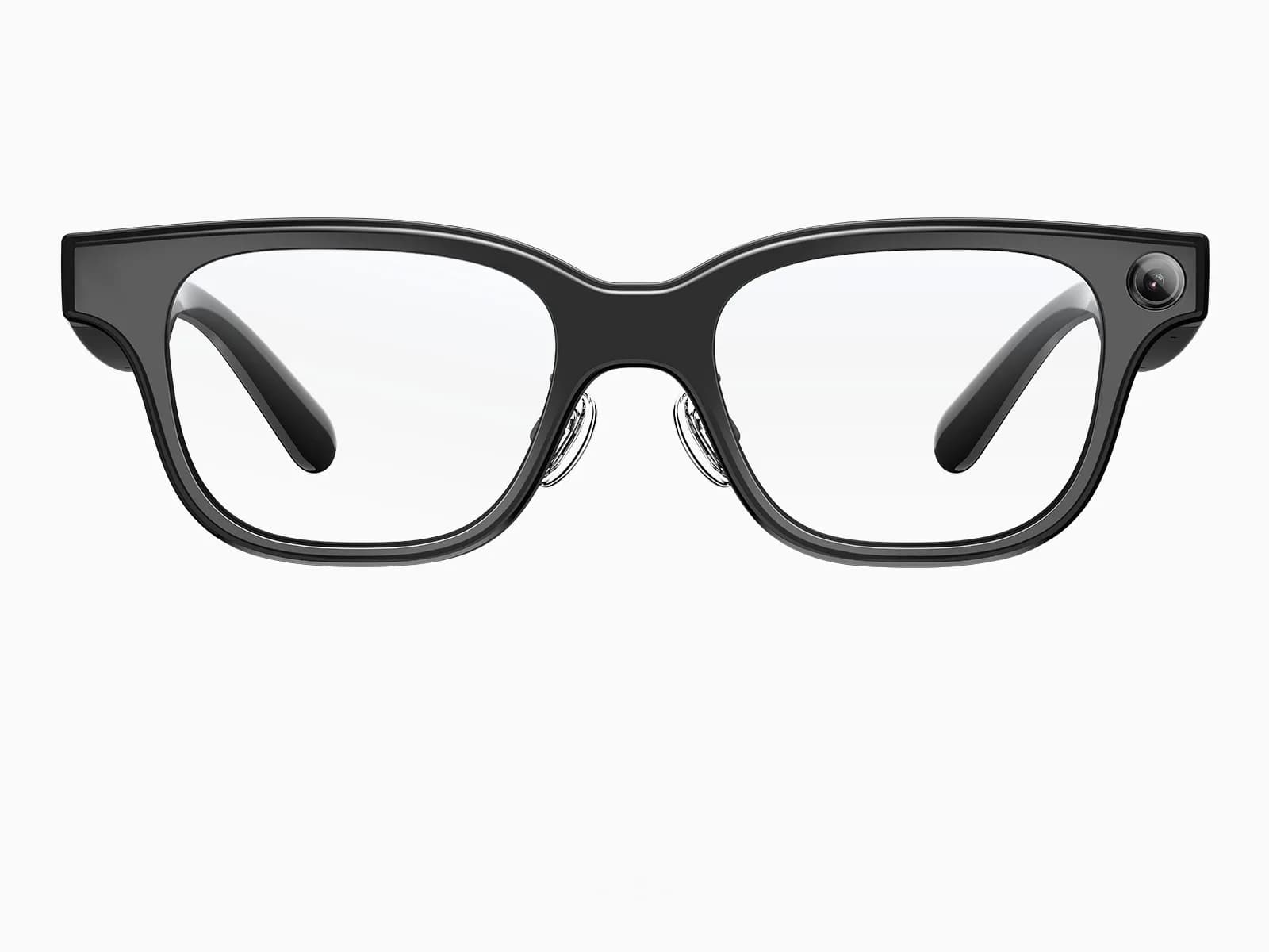 The Rokid Glasses RV101 seen head on against a white background: a thick black acetate frame in a squared wayfarer shape, clear lenses, transparent nose pads, and the round camera set into the upper outer corner of the right rim.