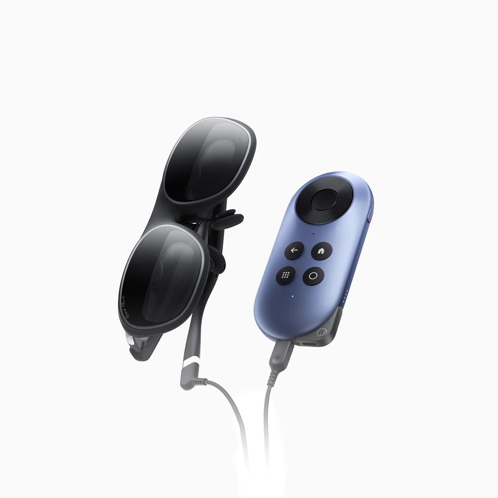 Rokid Max 2 folded and connected by a cable to a blue handheld controller with four buttons and a large dial.