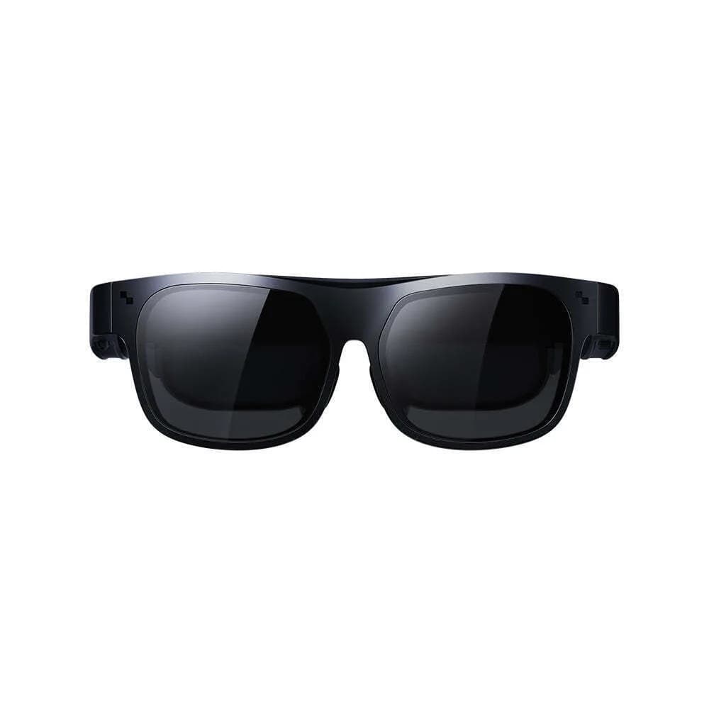 TCL NXTWEAR S+ display glasses in black with a wraparound frame and dark tinted lenses, shown front-on against a white background.