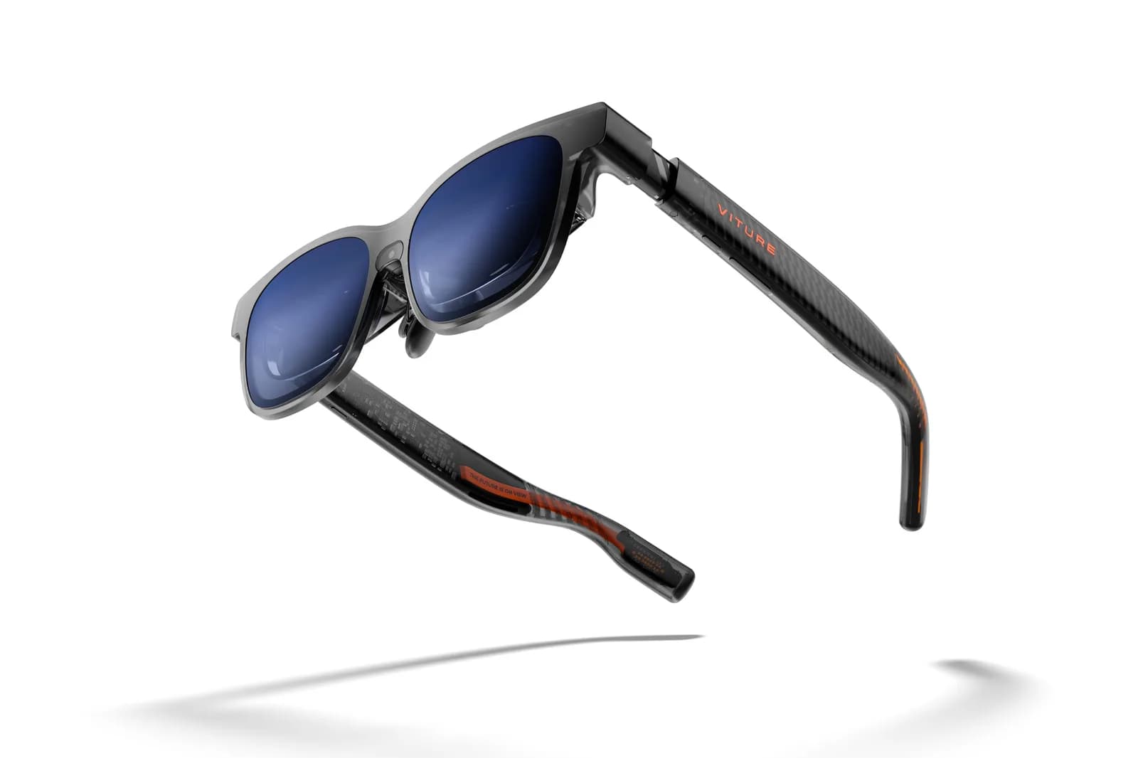VITURE Luma Pro AR glasses in smoke gray, shown at an angle with blue mirrored lenses and an orange VITURE logo on the temple, white background.