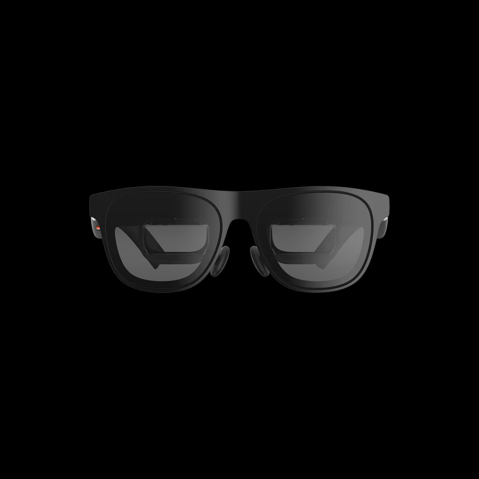 XREAL One Pro glasses in black, seen from the front on a white background, with a thick square frame and dark gradient lenses.